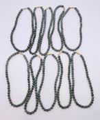 Ten various bead necklaces. Each approximately 40 cm long.