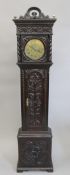 An 18th/19th century carved oak Grandmother clock with brass dial. 169 cm high.