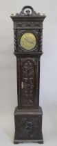 An 18th/19th century carved oak Grandmother clock with brass dial. 169 cm high.