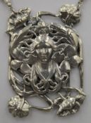 An Art Nouveau style silver pendant necklace. The pendant 6.5 cm high.