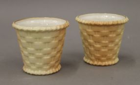 A pair of Royal Worcester porcelain baskets. 8 cm high.