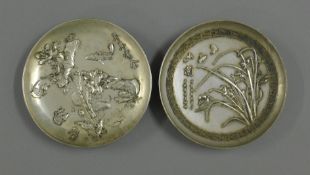 A pair of Chinese silver plated dishes. 11.5 cm diameter.