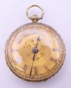 An Samuel Baster of Commercial Road East 18 ct gold cased open faced pocket watch. 3.5 cm diameter.