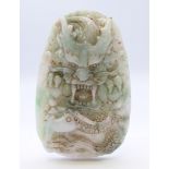 A Chinese light green and white jade dragon pendant, Qing Dynasty. 8 cm high.