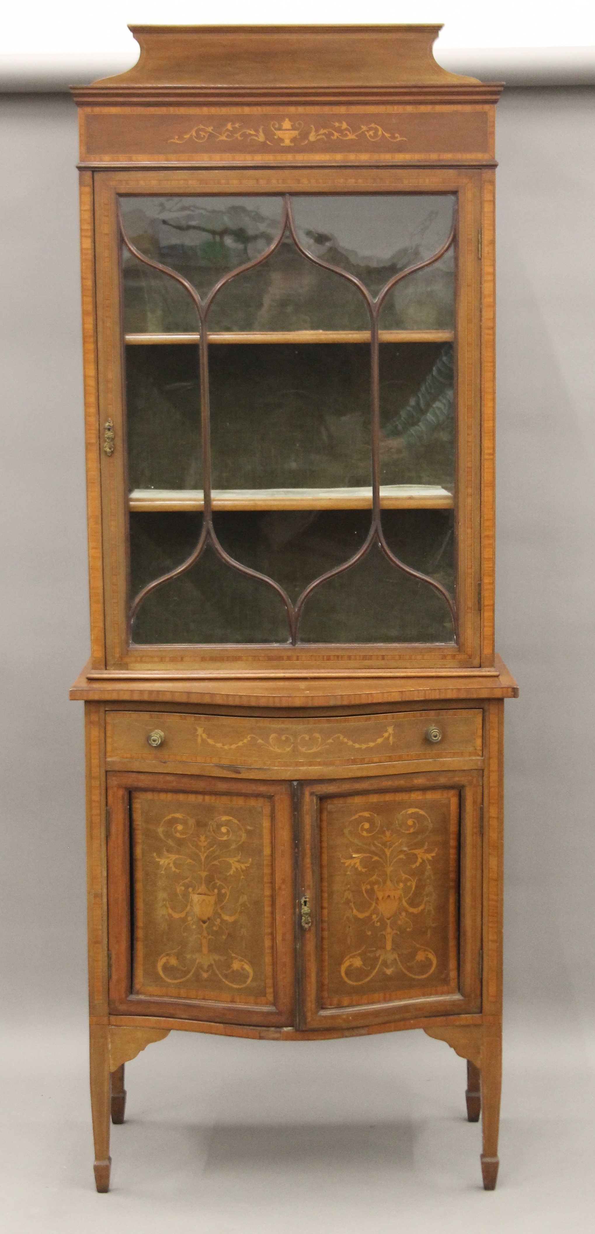 An Edwardian inlaid mahogany side cabinet. 79 cm wide x 215 cm high.