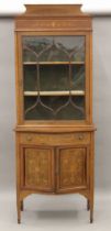 An Edwardian inlaid mahogany side cabinet. 79 cm wide x 215 cm high.