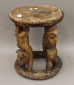 A late 19th/early 20th century African Yoruba Tribe stool/ceremonial table. 38.5 cm high.