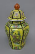A Chinese yellow ground porcelain lidded vase. 44 cm high.