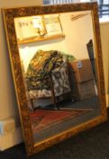 A large gilt framed mirror. 116 x 90.5 cm.