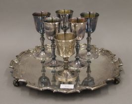 A large silver salver with presentation inscription and six various silver goblets. The salver 36.