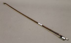 A violin bow, stamped Tourte. 68 cm long.