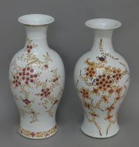 A pair of 19th century Chinese vases decorated with flowers. 43.5 cm high.