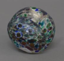 An Art glass paperweight, signed H.A.T.