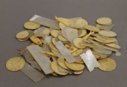 A quantity of 19th century bone and mother-of-pearl gaming counters, various sizes.