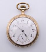 A Thomas Eaton gold filled open faced pocket watch, serial number 2210573. 5 cm diameter.