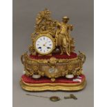 A 19th century porcelain mounted gilt spelter mantle clock surmounted with a huntsman,