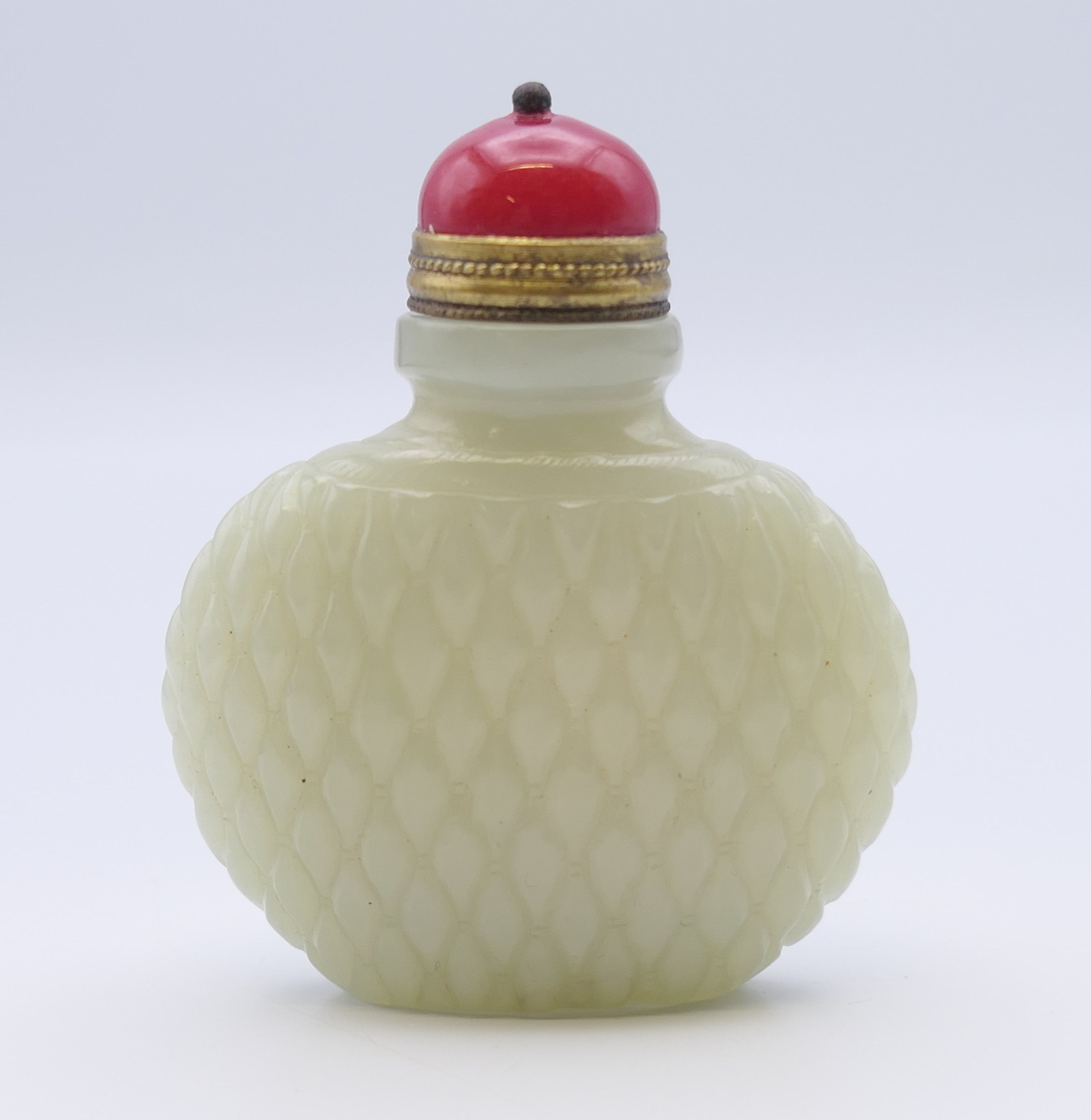 A Chinese white jade diamond cut pattern snuff bottle, with red stopper, Qing Dynasty. - Image 2 of 7