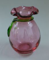 A cranberry glass vase. 17.5 cm high.