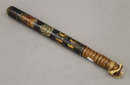An antique painted wooden truncheon. 43.5 cm long.