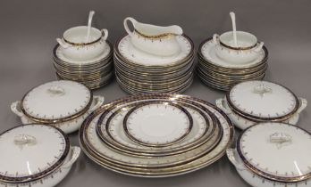 A Victorian gilt decorated blue and white dinner service.
