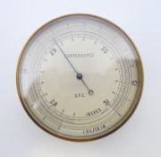 An early 20th century cased compensated barometer. 6 cm diameter.