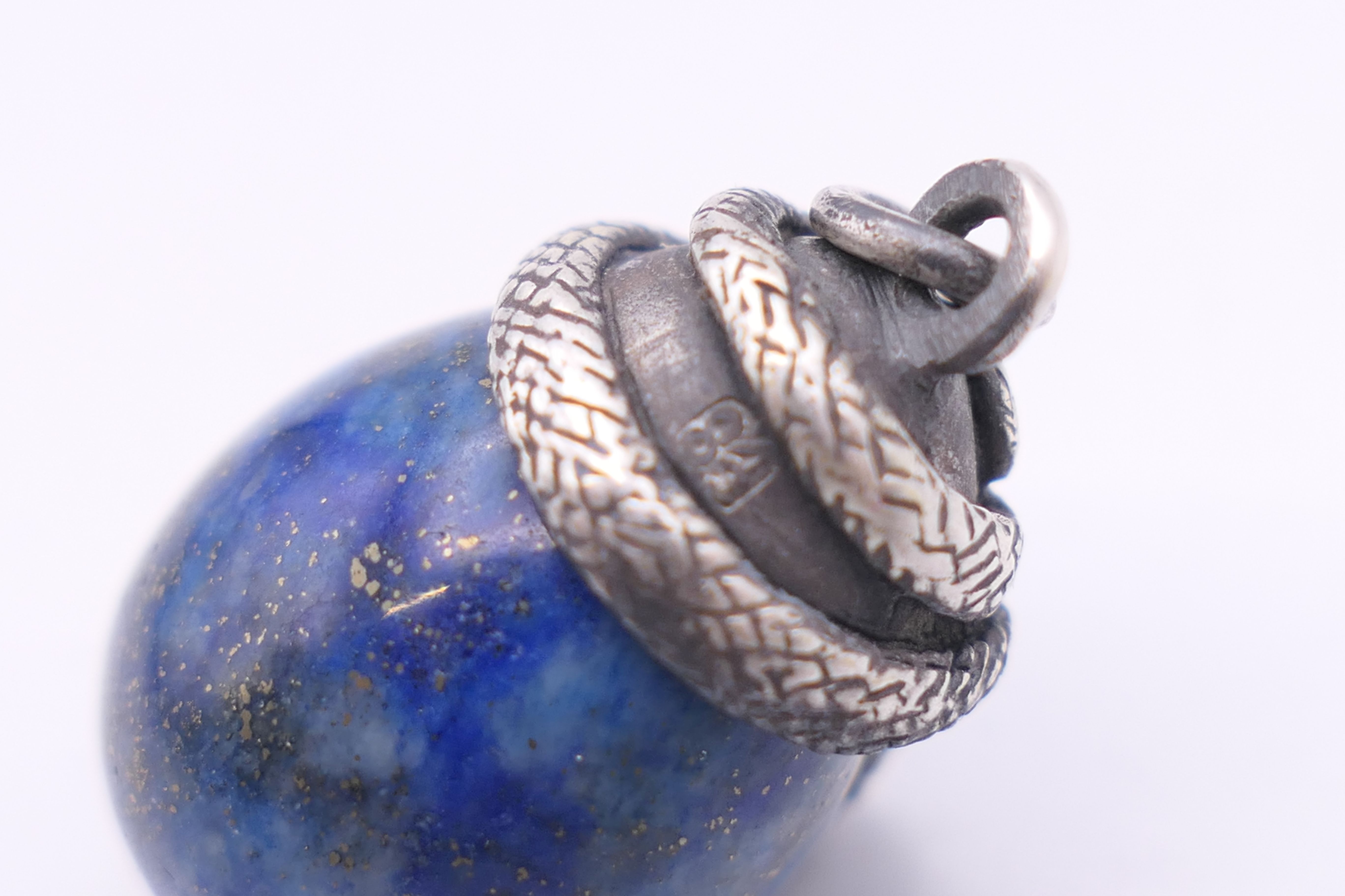 A lapis egg form pendant surmounted with a snake, bearing Russian marks. 2.5 cm high. - Image 4 of 4