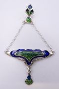 An Art Nouveau style pendant. 4 cm wide.