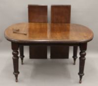 A Victorian mahogany two leaf extending dining table. 202 cm long extended.