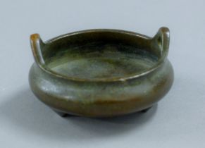 A small Chinese bronze censer. 8 cm wide.