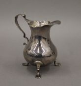 A Georgian silver cream jug. 10 cm high. 91.2 grammes.