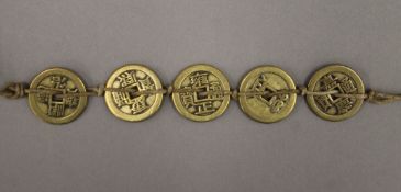 A string of Chinese coins.