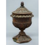 A carved oak cup and cover. 24 cm high.
