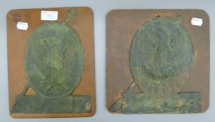 Two Victorian fire marks, each mounted to a board. The largest 24 cm high.