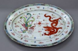 A 19th century Chinese porcelain plate. 33 cm long.