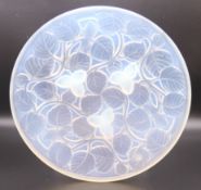 An Arrers opalescent glass dish. 24 cm diameter.