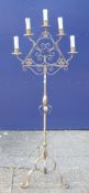 A wrought iron candelabra. 162 cm high.