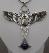 A silver and lapis scarab pendant necklace. The pendant 8.5 cm wide.