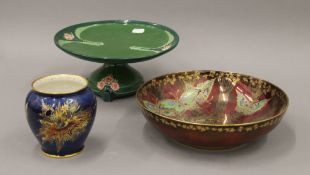 An Eichwald tazza, a Devon Fieldings lustre bowl and a Carltonware vase. The latter 11 cm high.