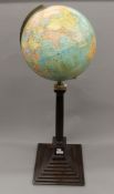 A George F Cram Co terrestrial globe on stand. 92 cm high.