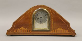 An Edwardian inlaid mahogany mantle clock. 24.5 cm wide.