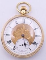An 18 ct gold pocket watch with florally engraved dial, serial number 15514. 4.25 diameter.