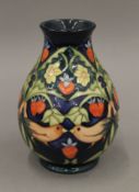 A Moorcroft vase. 18.5 cm high.