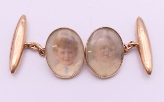 A pair of Victorian 15 ct gold cufflinks set with miniature portraits of children.