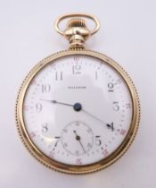 A Waltham gold plated open face pocket watch, the reverse engraved with a bird amongst foliage.