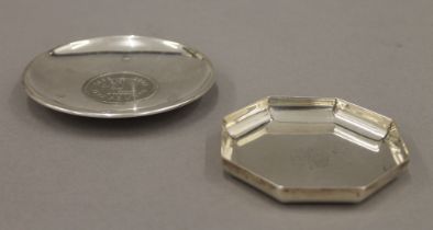 Two small silver dishes, one set with a coin. The largest 10 cm diameter. 124.