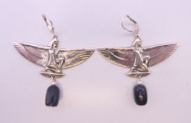 A pair of silver Egyptian Revival earrings. 5 cm wide.