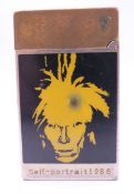 A Dupont Andy Warhol cigarette lighter. 6 cm high.