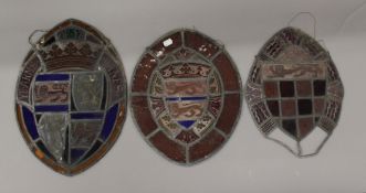Three pieces of antique Armorial leaded stained glass. The largest 45 cm high.