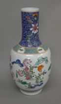 A Chinese florally decorated porcelain vase. 42 cm high.