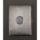 A silver card case. 10 cm wide. 109 grammes total weight.